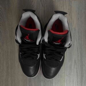 Nike Air Jordan 4 Retro 'Bred
Reimagined' 
Black and Red Air Jordan 4 Sneakers